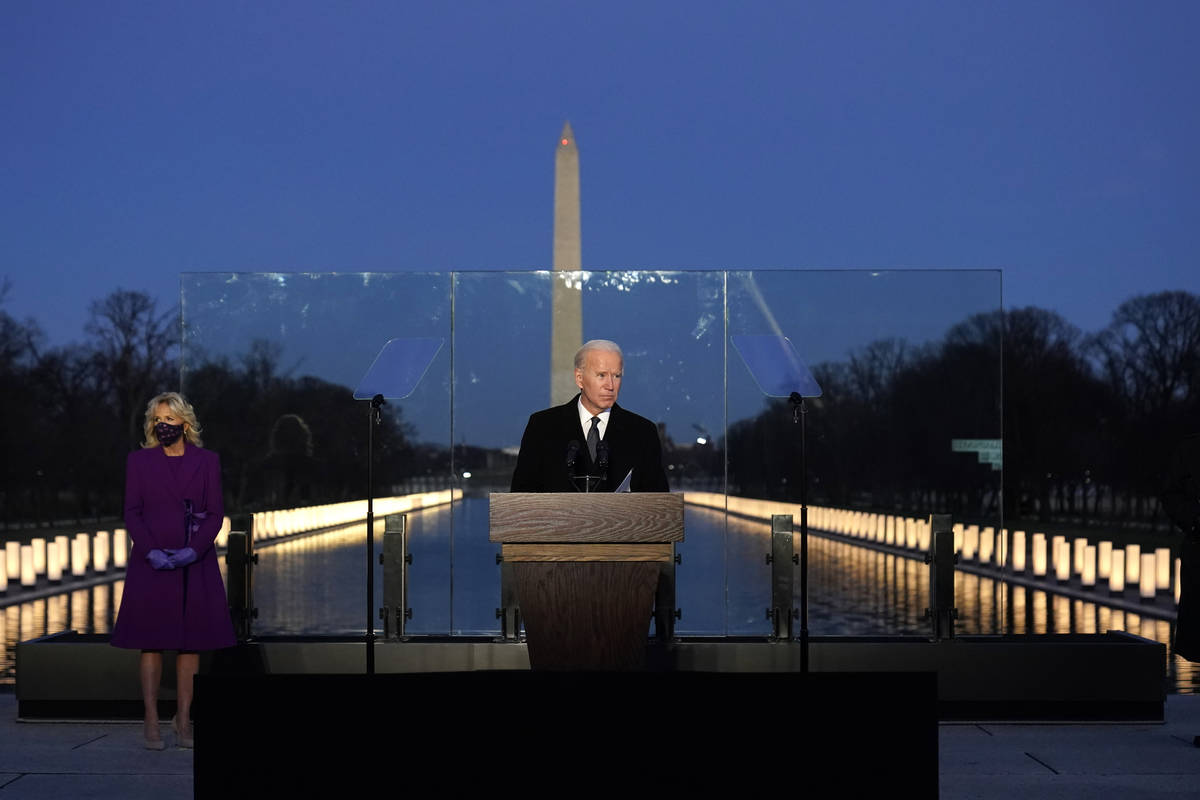 President-elect Joe Biden speaks during a COVID-19 memorial, with lights placed around the Linc ...