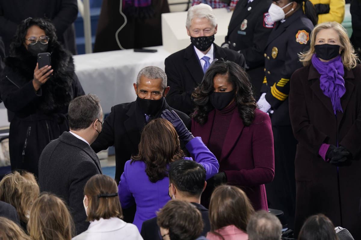 President-elect Kamala Harris and her husband Doug Emhoff talk with former President Barack Oba ...