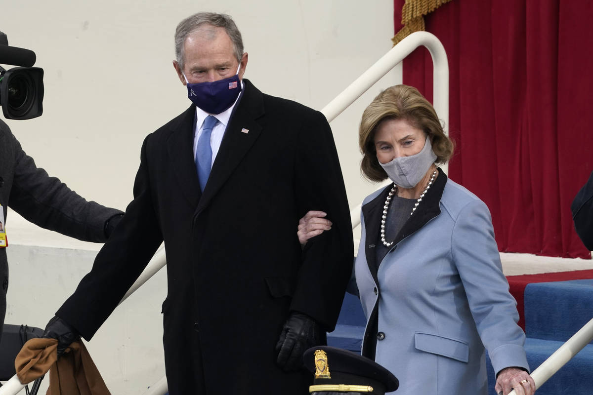 Former President George W. Bush and his wife Laura arrive for the 59th Presidential Inauguratio ...