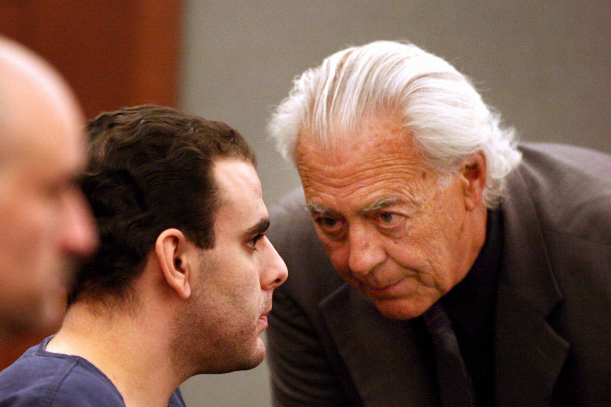 Attorney Bill Terry, right, talks with his client Anthony Carleo in Clark County District Court ...