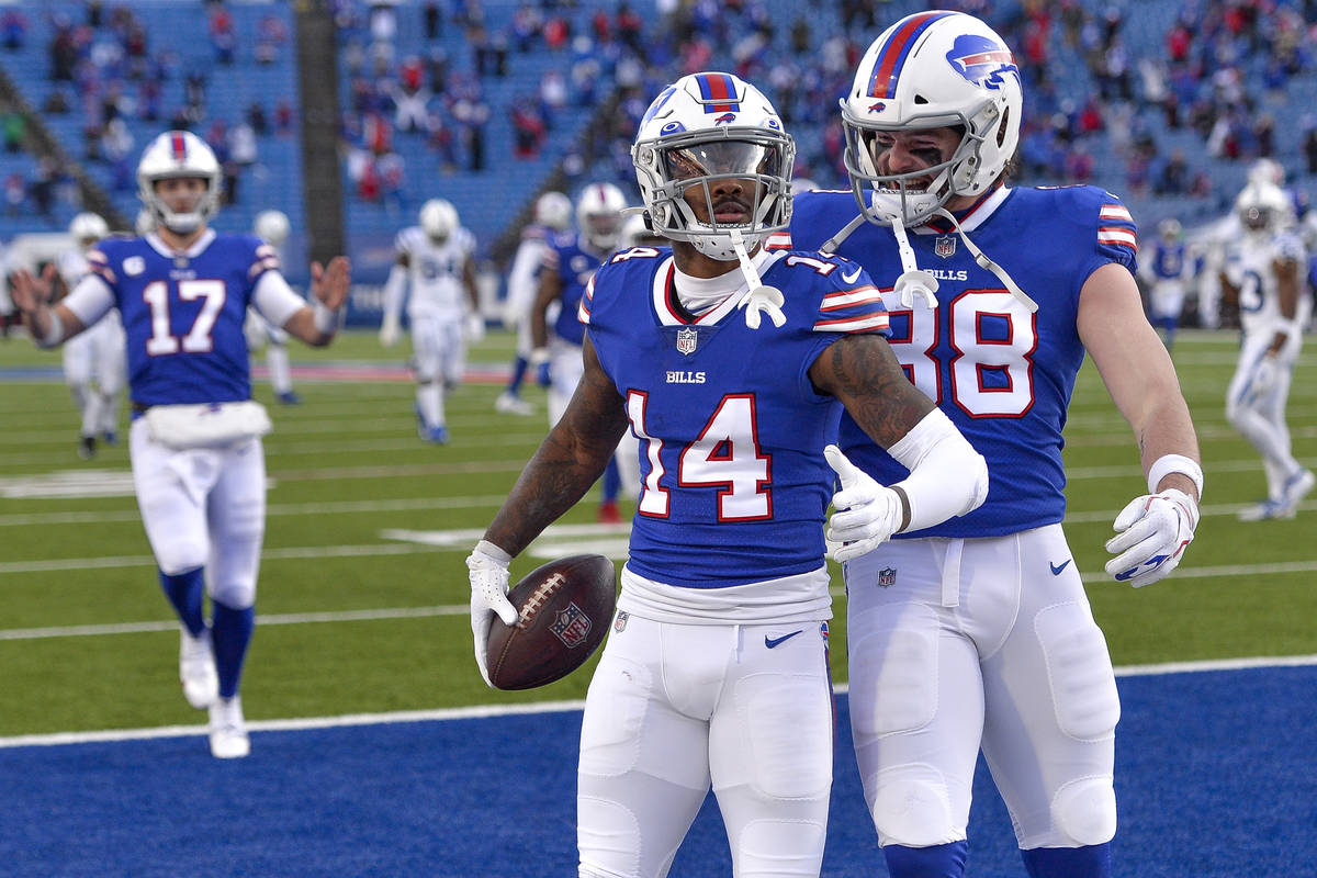 Buffalo Bills wide receiver Stefon Diggs (14) celebrates with tight end Dawson Knox (88) after ...