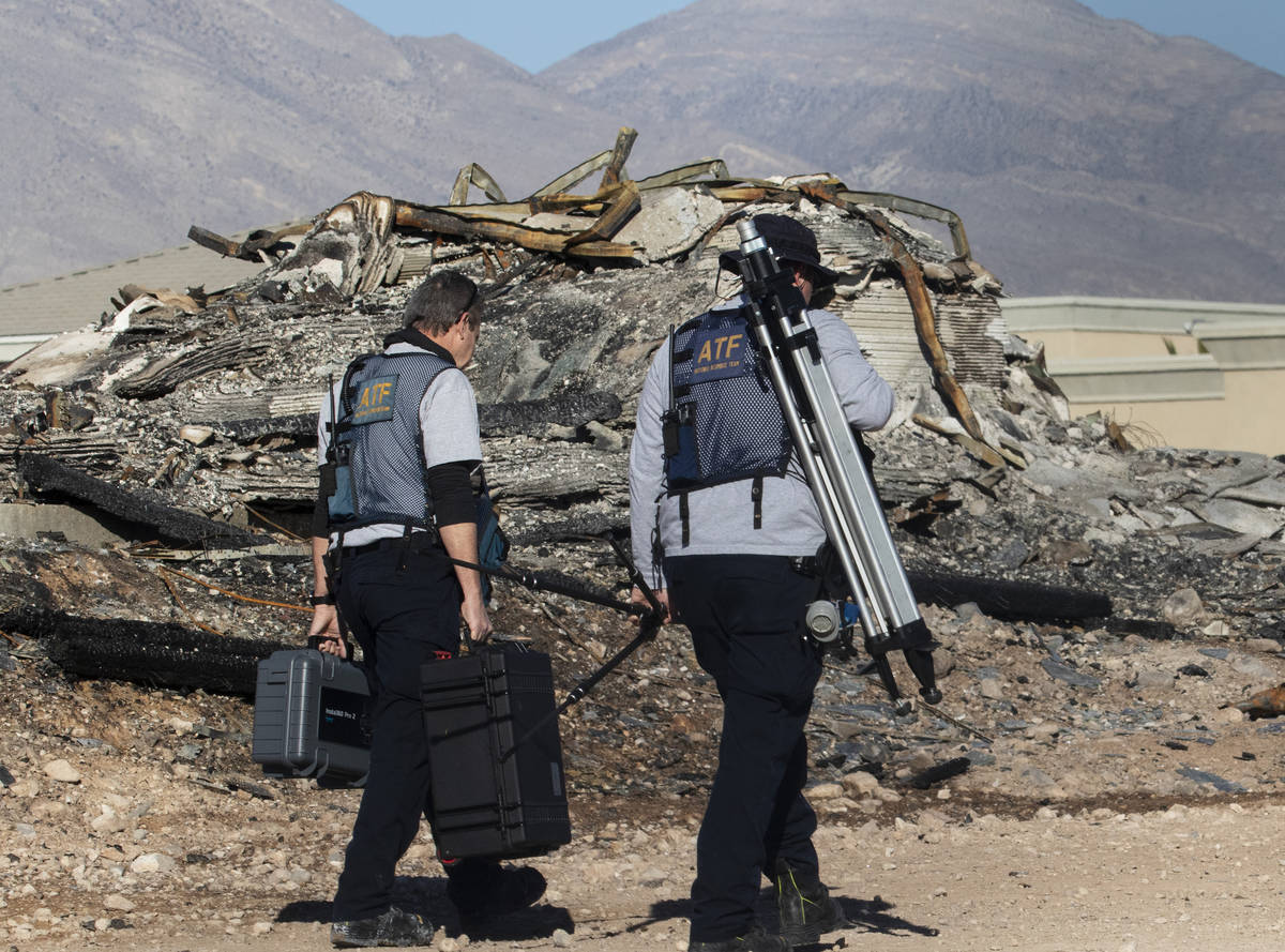 A team of Alcohol, Tobacco, Firearms and Explosives (ATF) investigators arrive at the under con ...