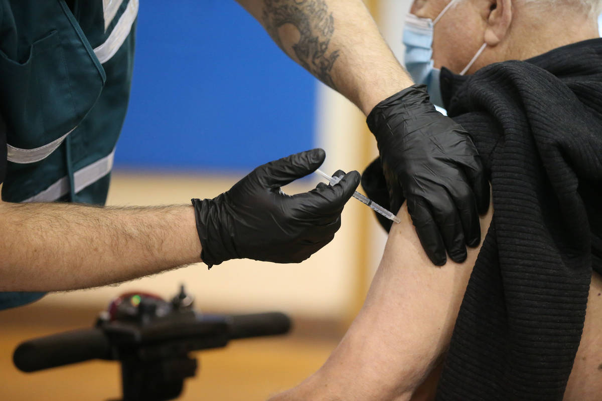 People in line to get the COVID-19 vaccine at the Neighborhood Recreation Center in North Las V ...