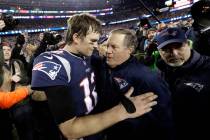 In this Jan. 21, 2018, file photo, New England Patriots quarterback Tom Brady, left, hugs coach ...