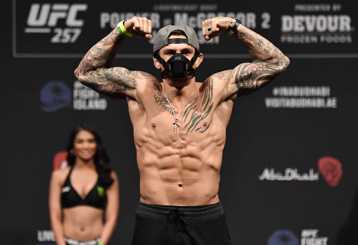 Dustin Poirier poses on the scale during the UFC 257 weigh-in at Etihad Arena on UFC Fight Isla ...