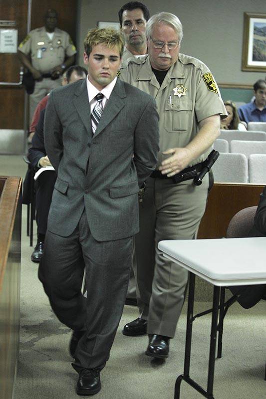 Steven Gazlay is taken into custody after being sentenced in District Court on Aug. 6, 2004. (R ...