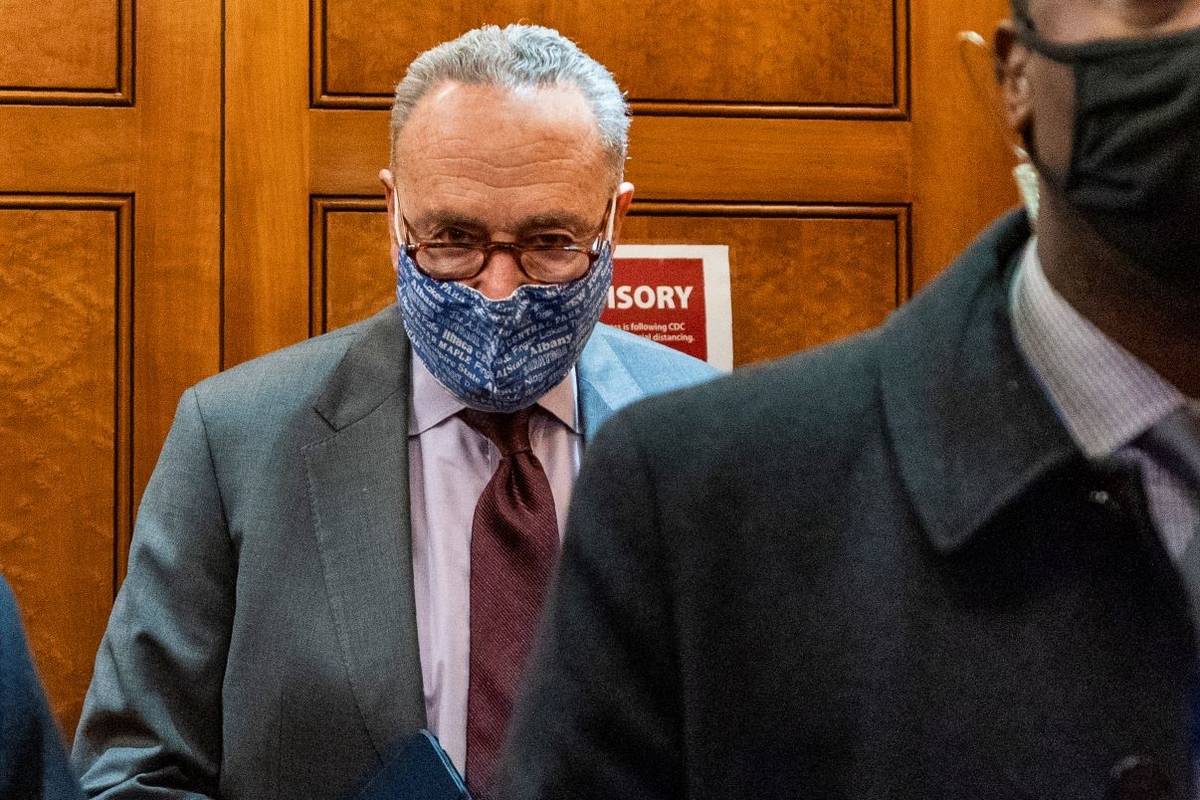 Senate Majority Leader Chuck Schumer of N.Y, takes the elevator in the U.S. Capitol , Friday, J ...