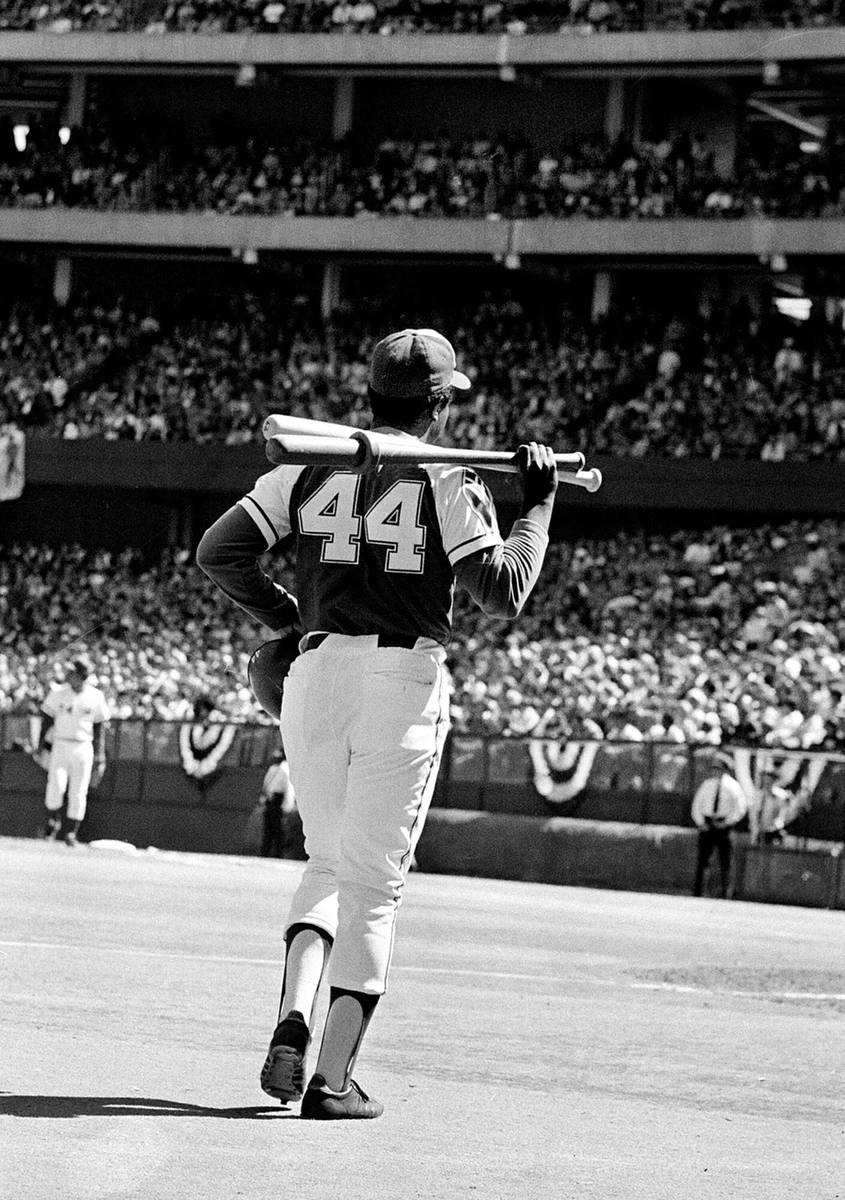Atlanta Braves' right-handed slugger Hank Aaron (44) walks out from the batting circle in game ...