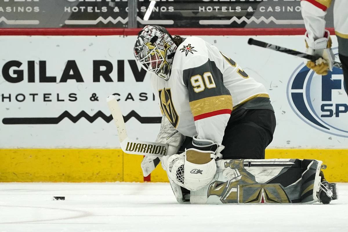 Vegas Golden Knights goaltender Robin Lehner pauses on the ice after giving up a goal to Arizon ...