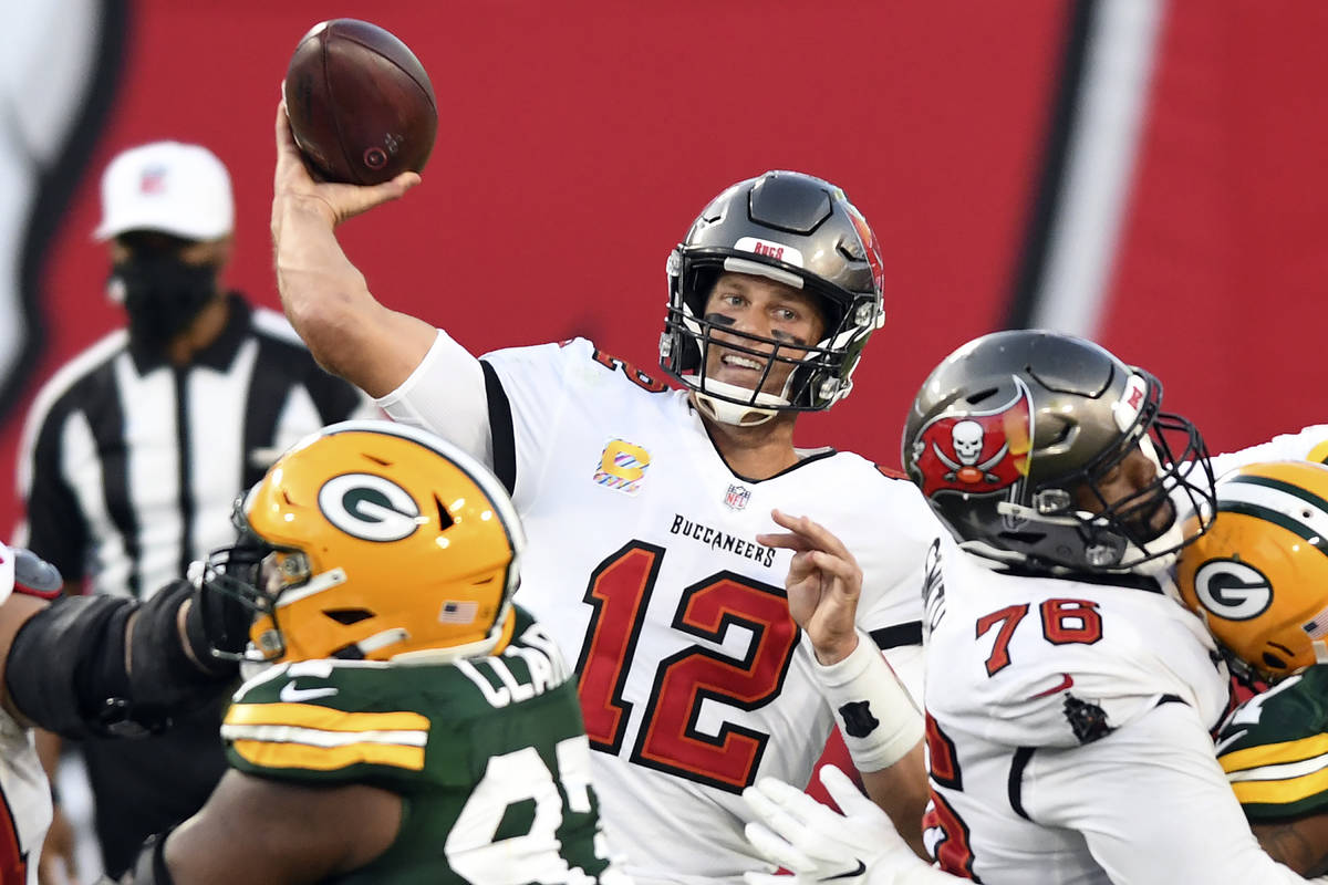 Tampa Bay Buccaneers quarterback Tom Brady (12) throws a pass against the Green Bay Packers dur ...