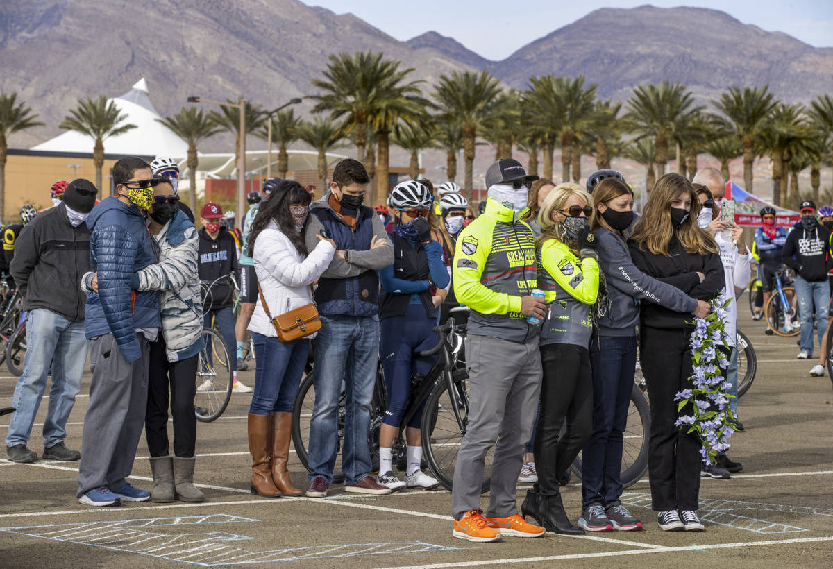 Friends and family gather to honor the five cyclists recently killed in Searchlight during the ...