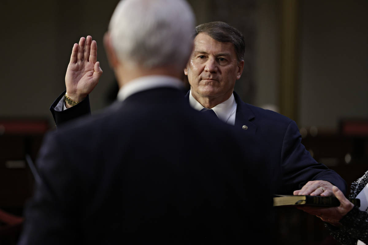 Vice President Mike Pence administers the oath of office to Sen. Mike Rounds, R-S.D, during a r ...
