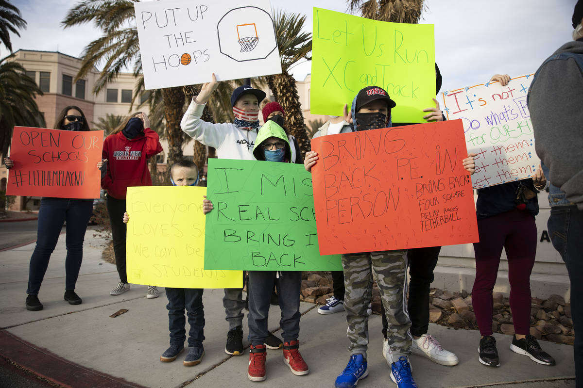 Henderson siblings, clockwise from left, Emel Adams, 6, Scottie, 14, Tate, 11, and J., 8, prote ...