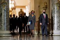 Clerk of the House Cheryl Johnson along with acting House Sergeant-at-Arms Tim Blodgett, lead t ...