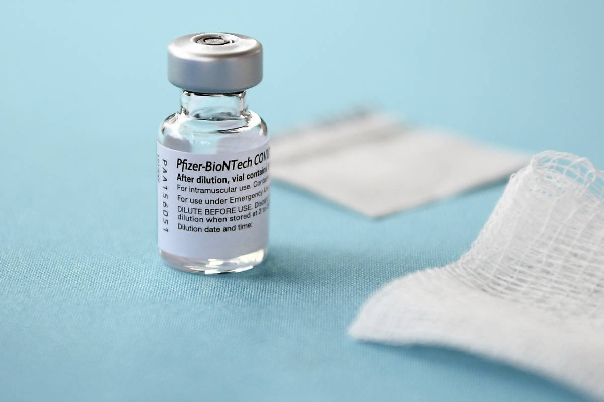 In a Monday, Dec. 14, 2020, file photo, a vial of the Pfizer-BioNTech vaccine for COVID-19 sits ...