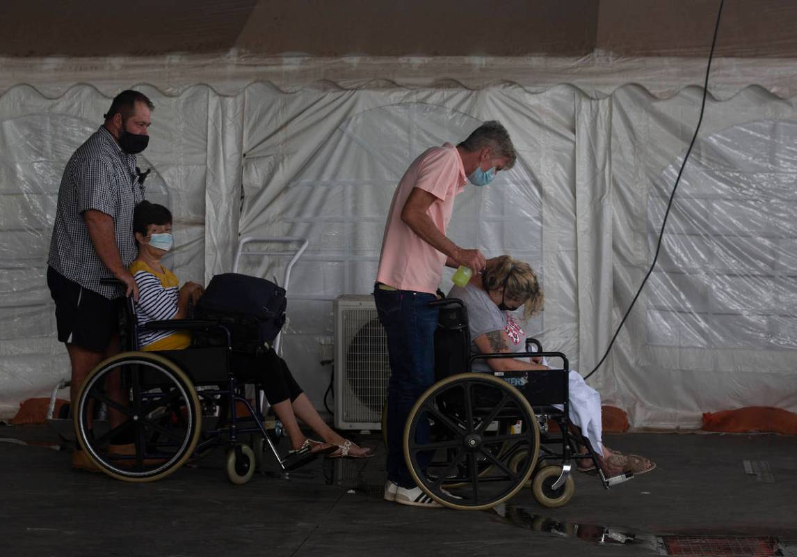 Patients wait to be attended to at the Steve Biko Academic Hospital's outside parking area in P ...