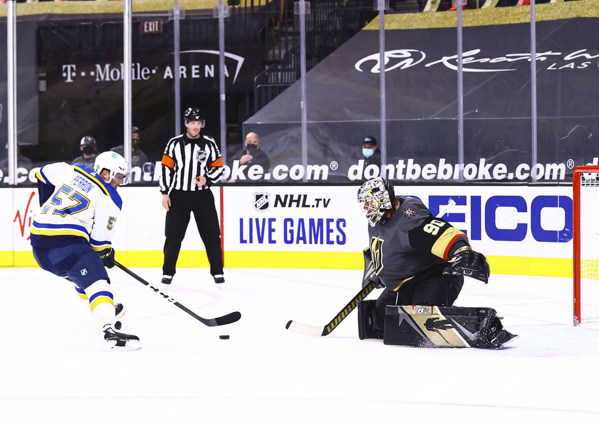 St. Louis Blues left wing David Perron (57) lines up his shot before scoring past Golden Knight ...