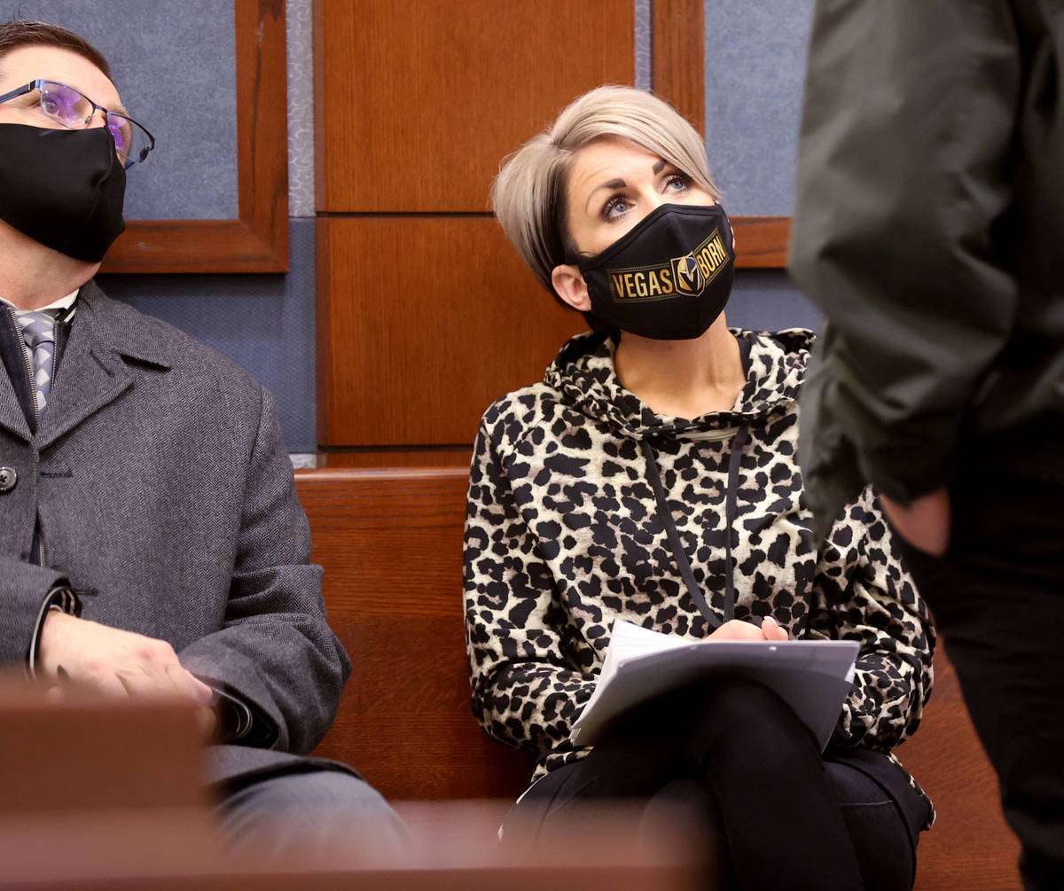 Dana Nee waits to appear in court with her attorney, Paul Andras, left, and her private investi ...