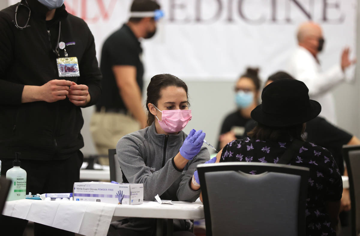 Medical student Ashley Prandecki gives a COVID-19 vaccine during a UNLV Medicine clinic in the ...