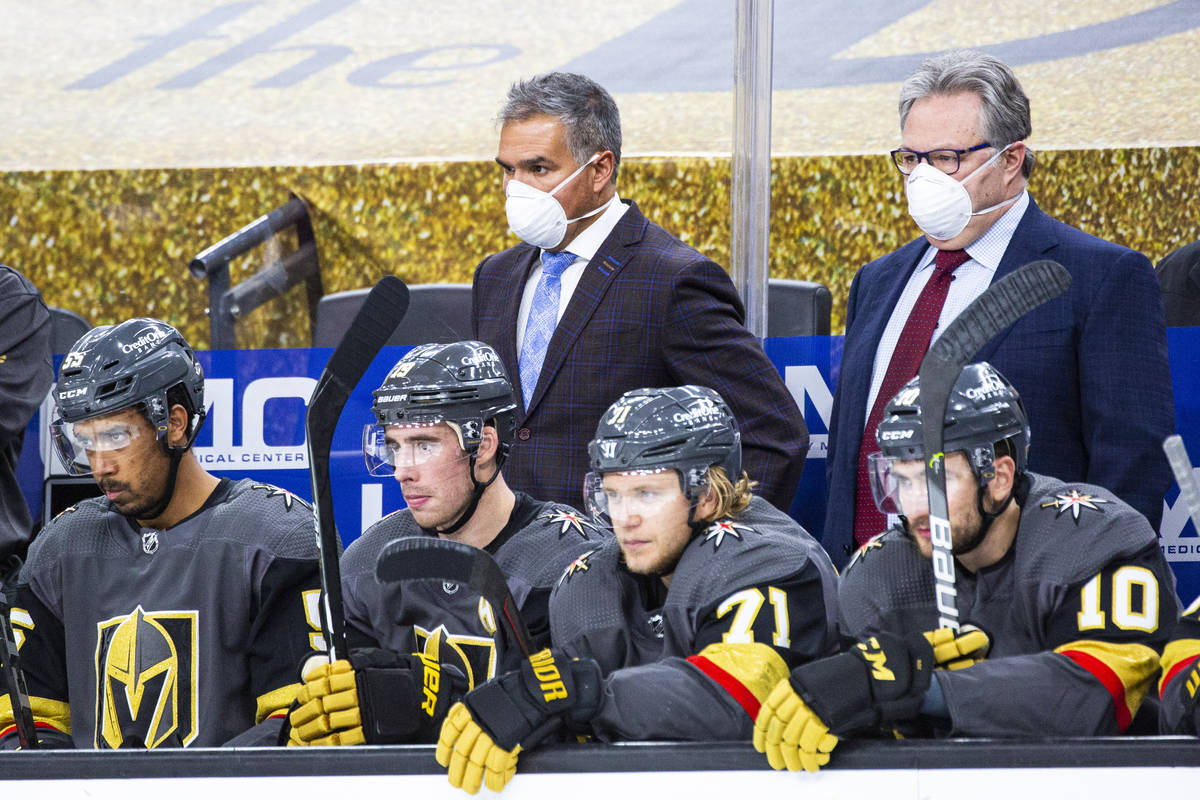 Silver Knights head coach Manny Viveiros, center left, and Golden Knights general manager Kelly ...