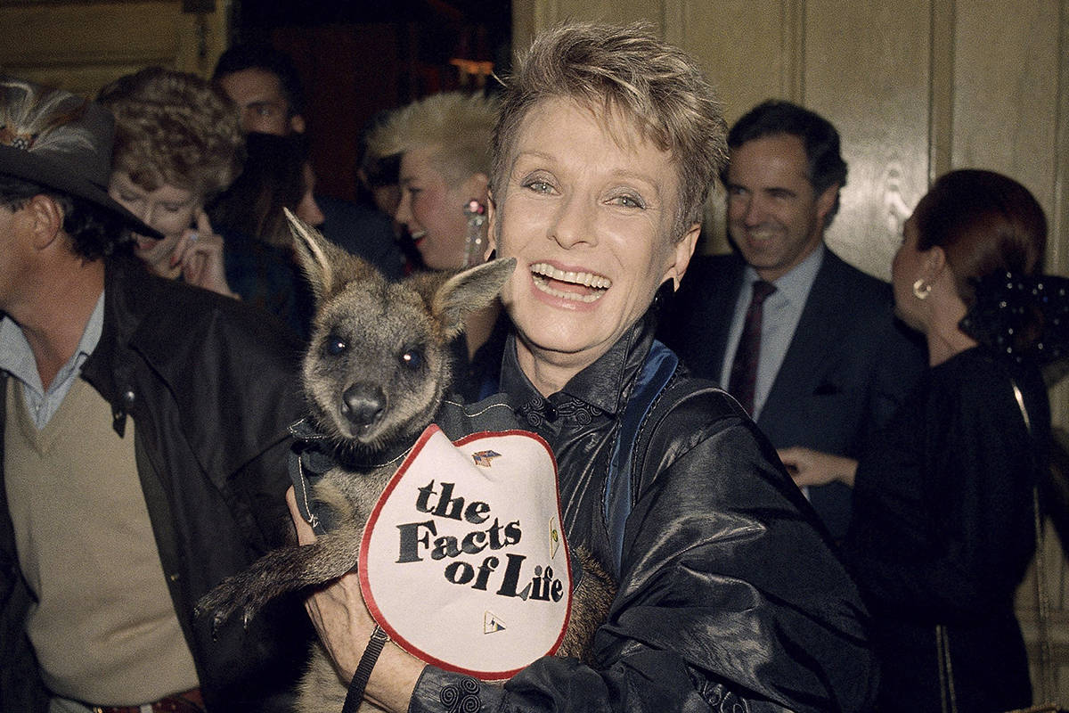 FILE - Actress Cloris Leachman, a star in the TV series "Facts of Life," hoists an Au ...
