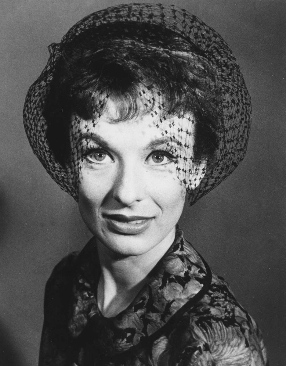 FILE - Actress Cloris Leachman wears a headband hat with black tulip shaped veiling, called a t ...