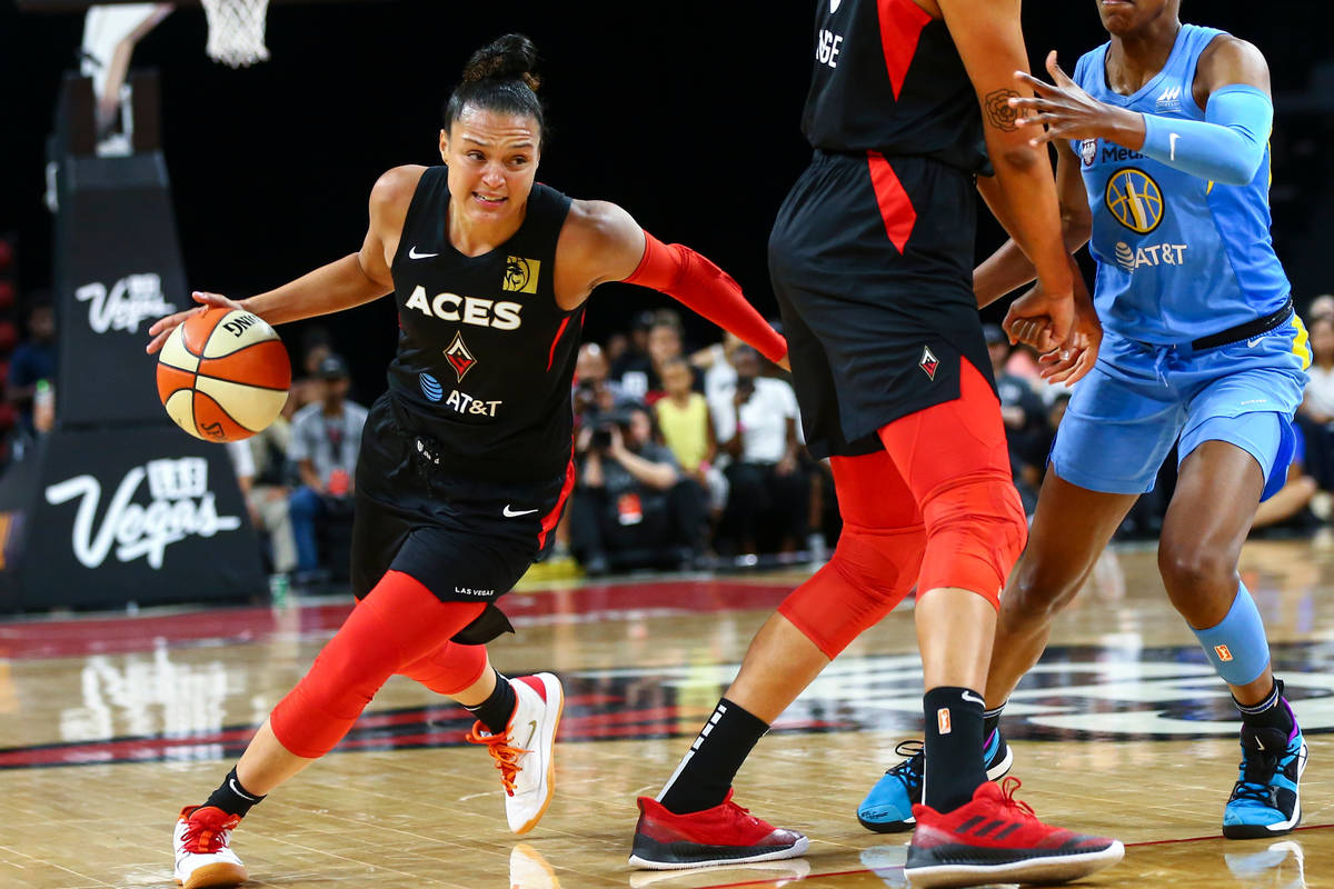 Las Vegas Aces' Kayla McBride (21) moves the ball against Chicago Sky during the first half of ...