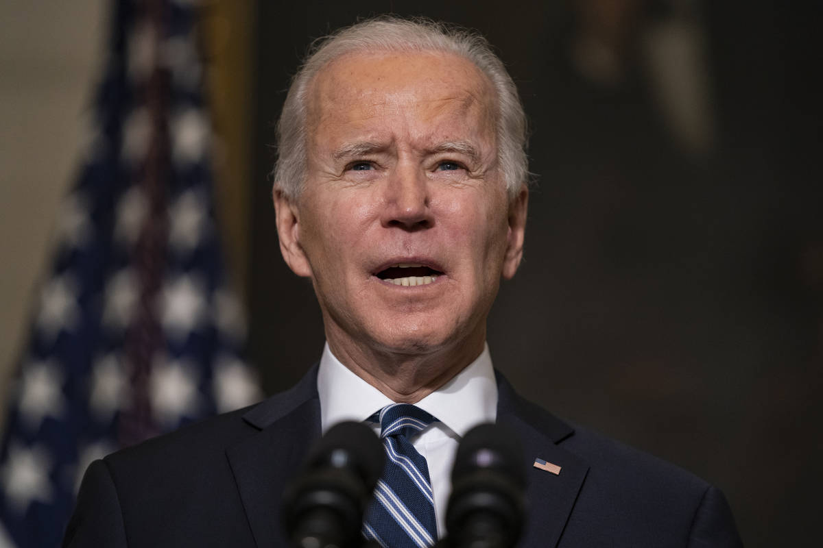 In this Jan. 27, 2021, photo, President Joe Biden speaks in the State Dining Room of the White ...