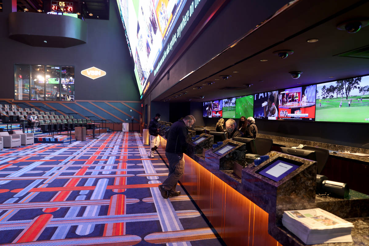 People place bets at Circa sportsbook in downtown Las Vegas Thursday, Jan. 28, 2021. (K.M. Cann ...
