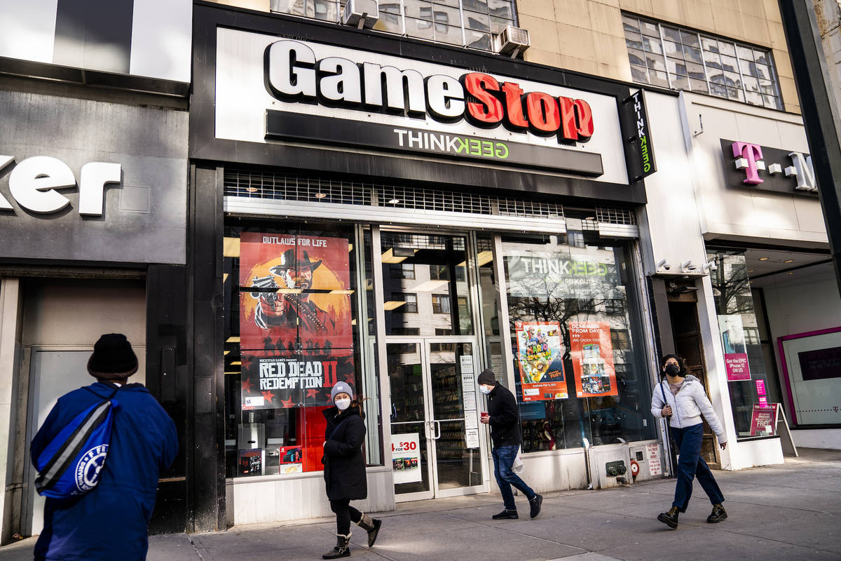 Pedestrians pass a GameStop store on 14th Street at Union Square, Thursday, Jan. 28, 2021, in t ...