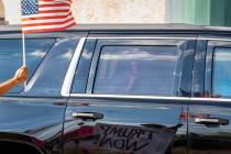Former President Donald Trump passes supporters while traveling in his motorcade in West Palm B ...