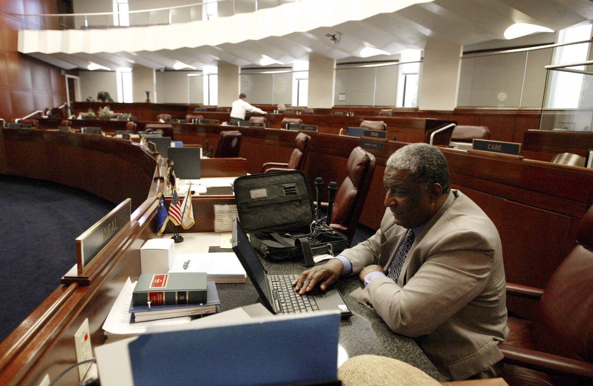 Sen. Joe Neal, D-North Las Vegas, works at his desk in the Senate chambers at the Legislature i ...