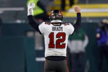 Tampa Bay Buccaneers quarterback Tom Brady reacts after winning the NFC championship NFL footba ...