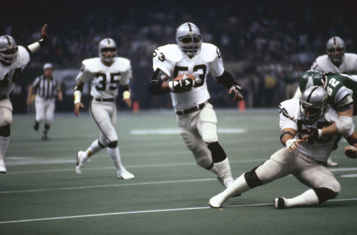 Oakland Raiders linebacker Rod Martin (53) intercepts a pass and runs upfield during Super Bowl ...
