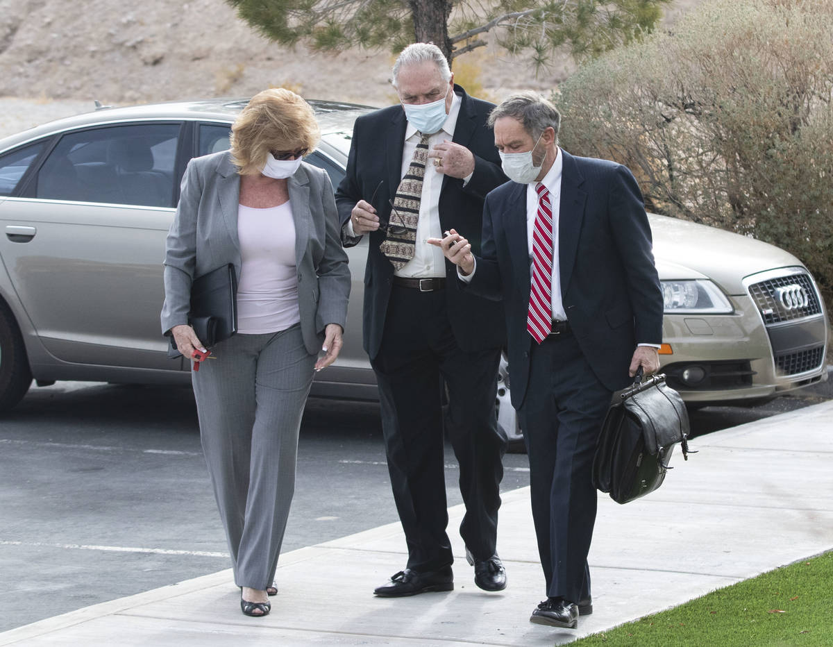 Patricia, left, and her husband Marcel Chappuis arrive with their attorney, Thomas Gibson, righ ...