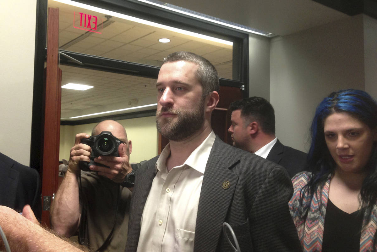 FILE - In this May 29, 2015, file photo, television actor Dustin Diamond, center, leaves court ...