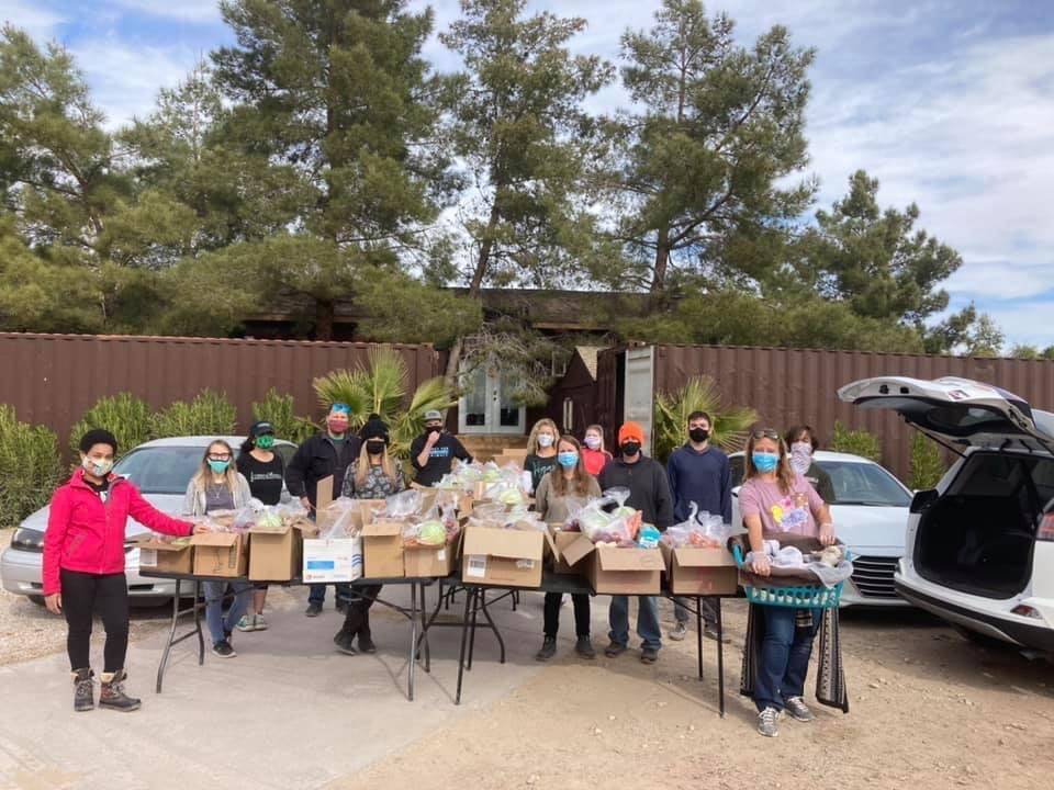 LasVegan Food Bank volunteers with the food boxes they assembled to distribute to vegans in nee ...
