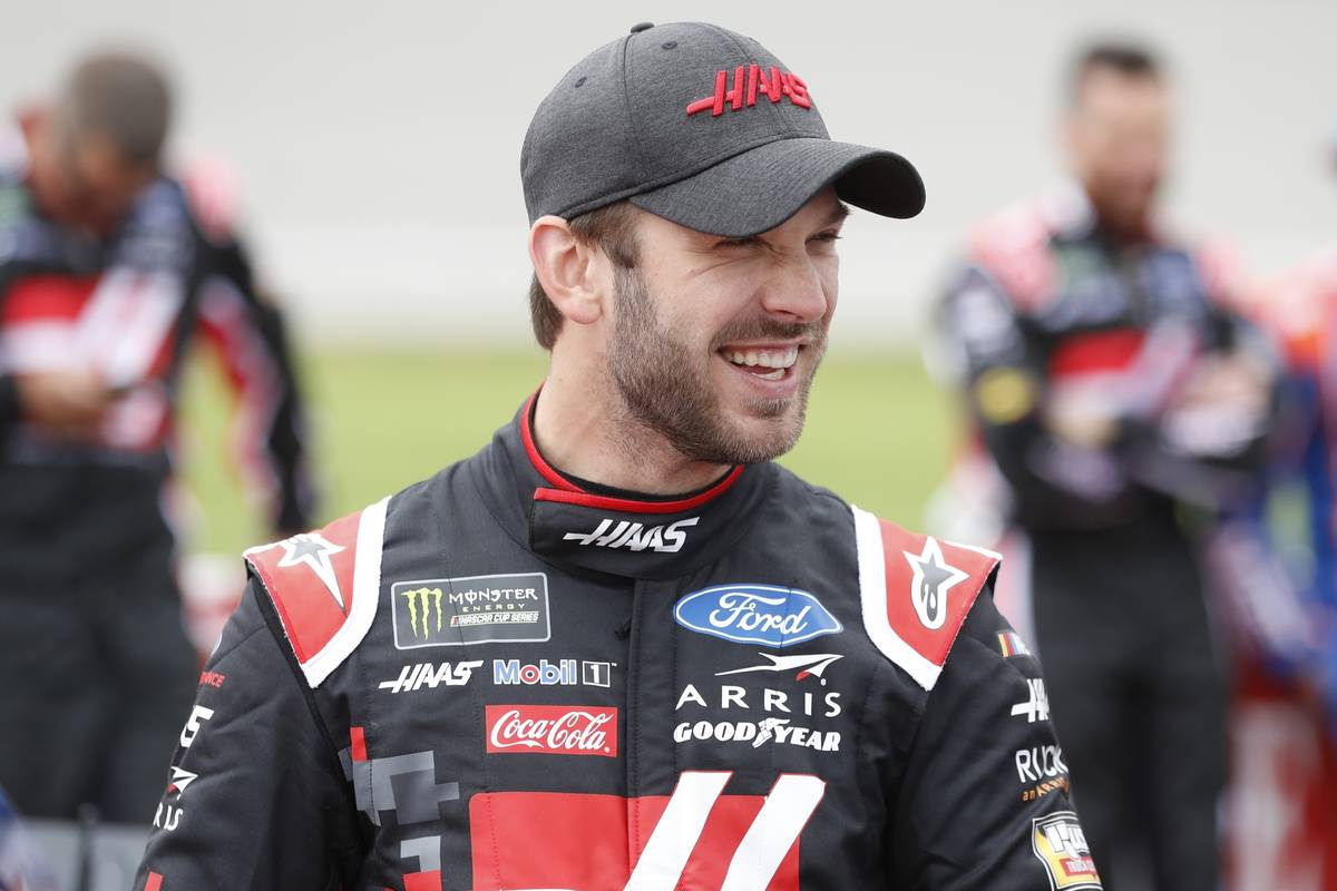 Daniel Suarez stands next to his car before a NASCAR cup series auto race at Michigan Internati ...