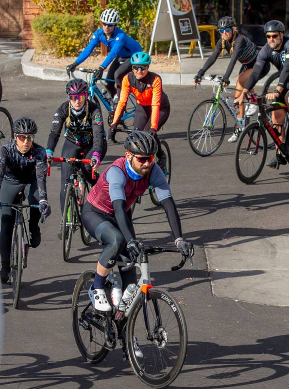 In this Dec. 12, 2020, file photo, cyclist do a ride-by tribute during a vigil honoring the liv ...