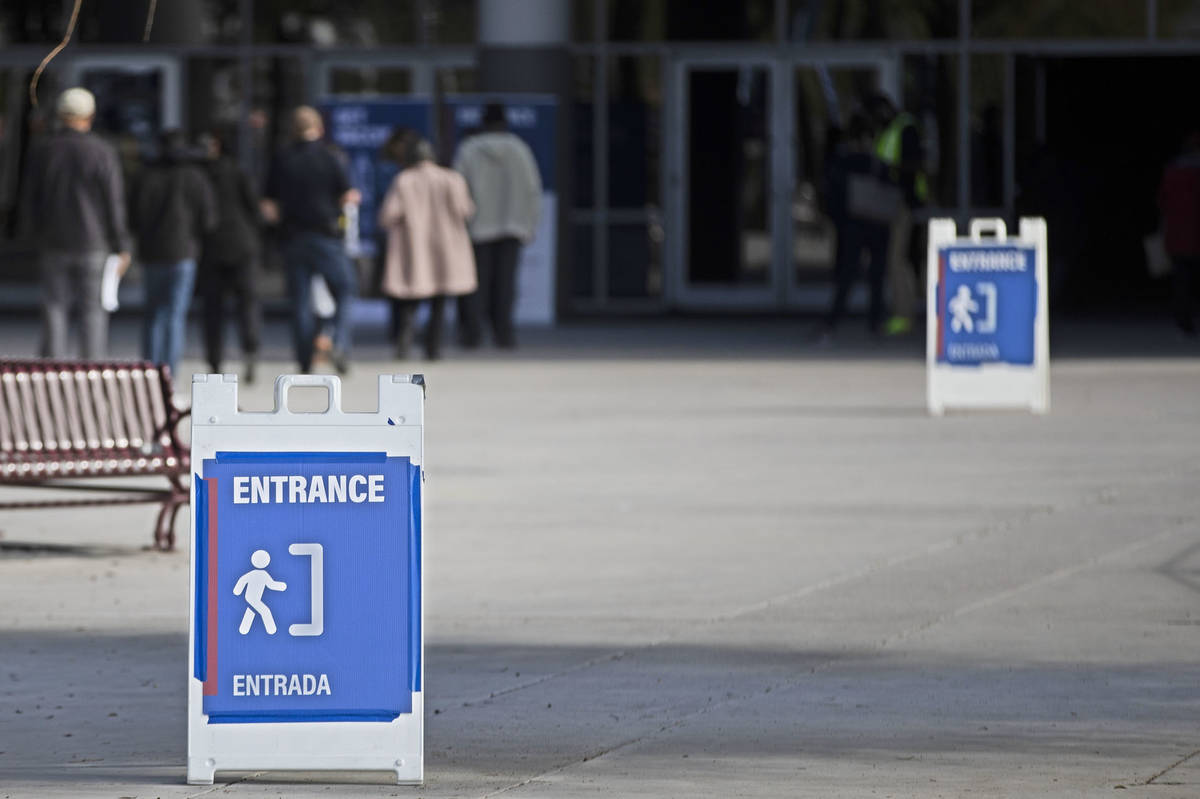 COVID-19 vaccination site entrance signs at the Las Vegas Convention Center in Las Vegas, on T ...