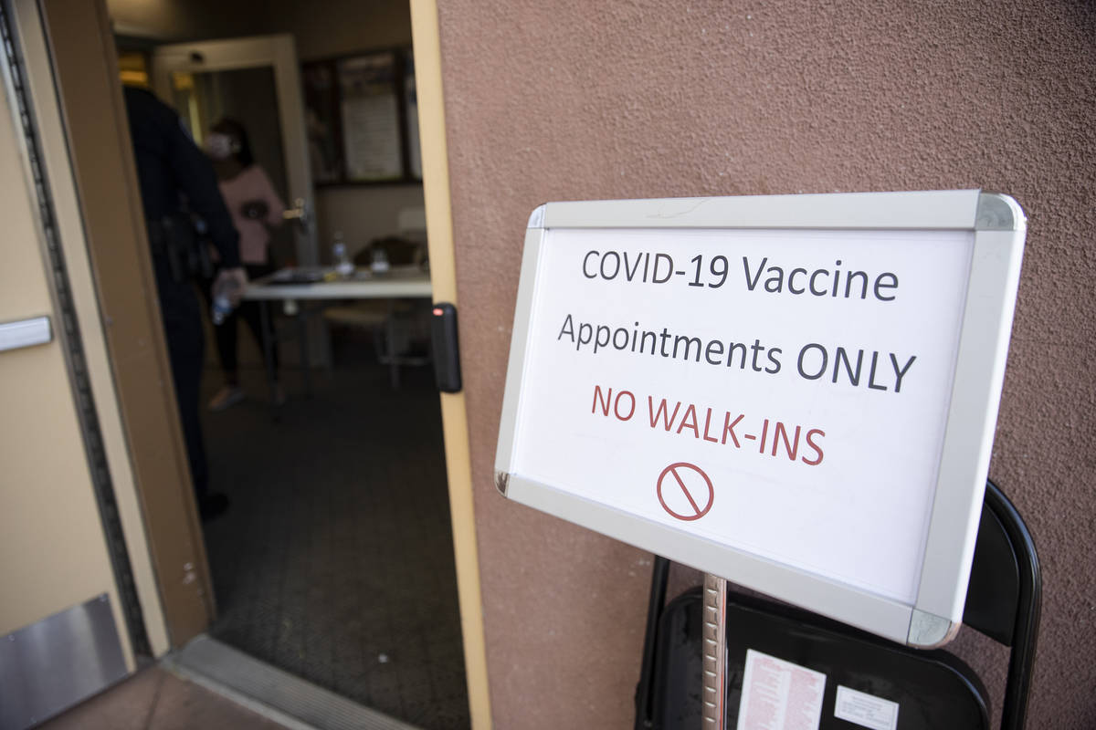 A sign at the entrance to the COVID-19 vaccination site at Doolittle Senior Center in Las Vegas ...