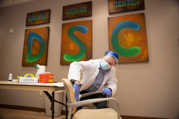 Justin McConnell, student pharmacist at Roseman University of Health Sciences, gets ready to ad ...