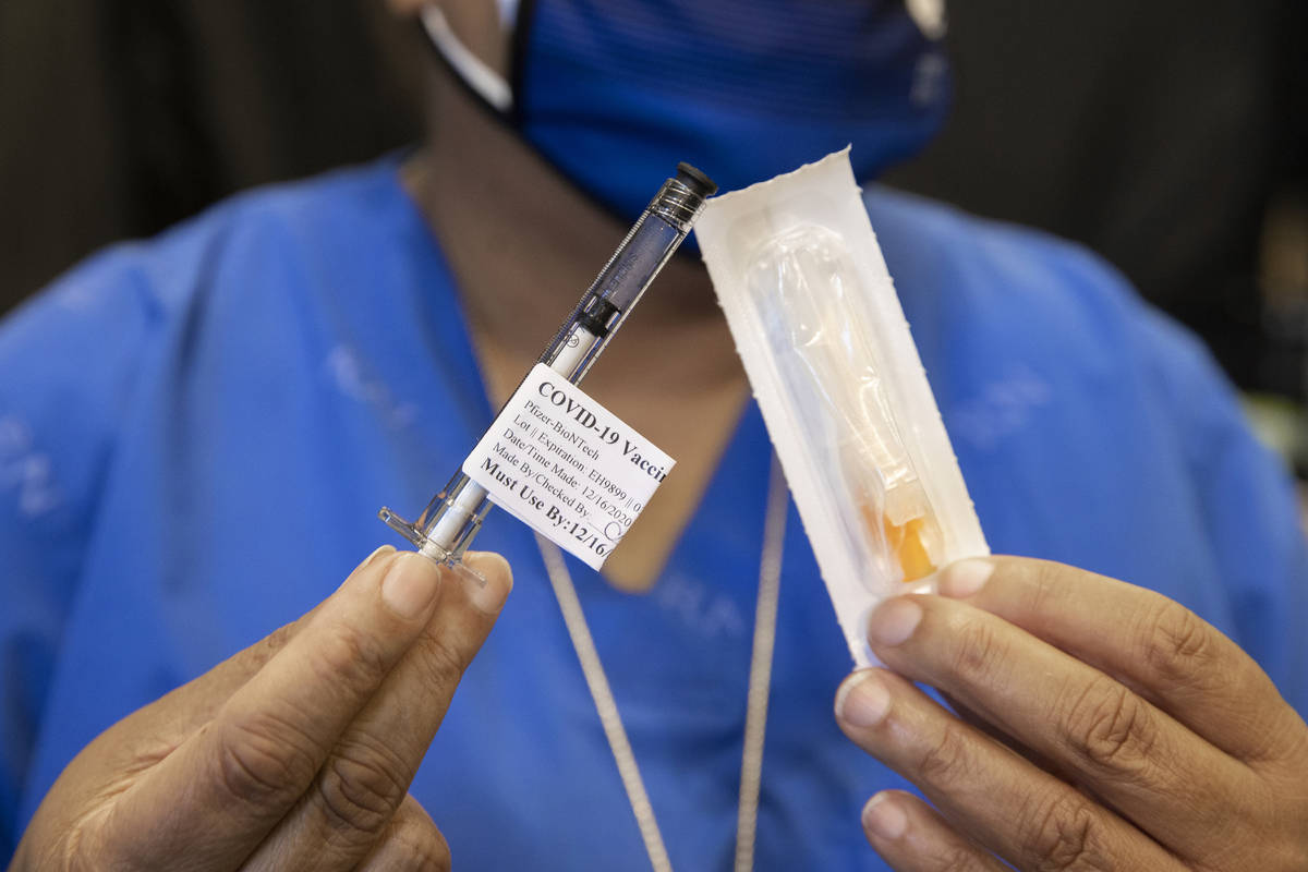 A syringe containing the COVID-19 vaccine at the North Las Vegas VA Medical Center on Wednesday ...