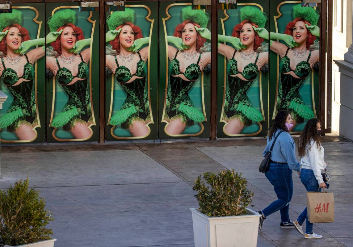 Several shoppers move past the Absinthe main doors nears Caesars Palace along the Las Vegas Str ...