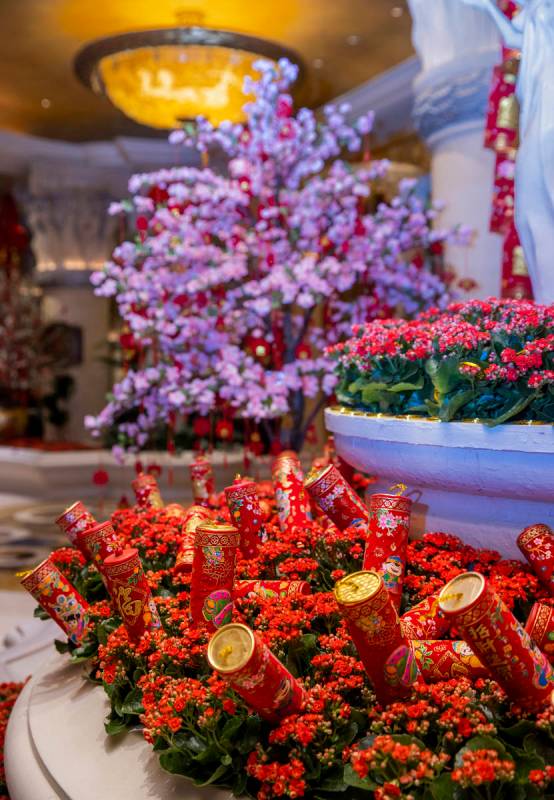 Fireworks and colorful landscaping as part of the decorations for the Lunar New Year near the c ...