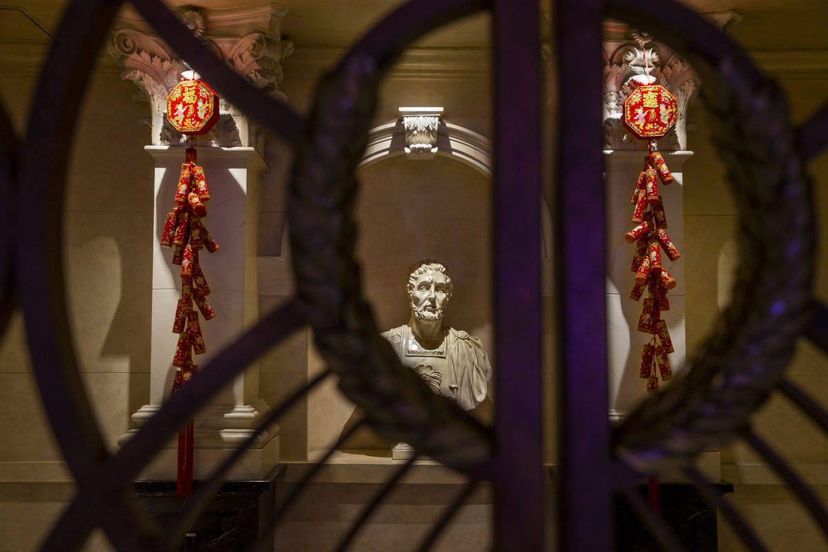 Fireworks and good luck symbols are hung as part of the decorations for the Lunar New Year thro ...