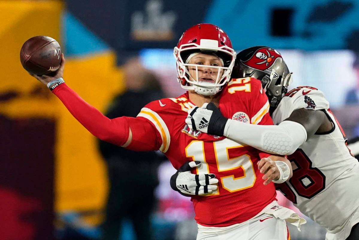 Kansas City Chiefs quarterback Patrick Mahomes passes under pressure from Tampa Bay Buccaneers ...