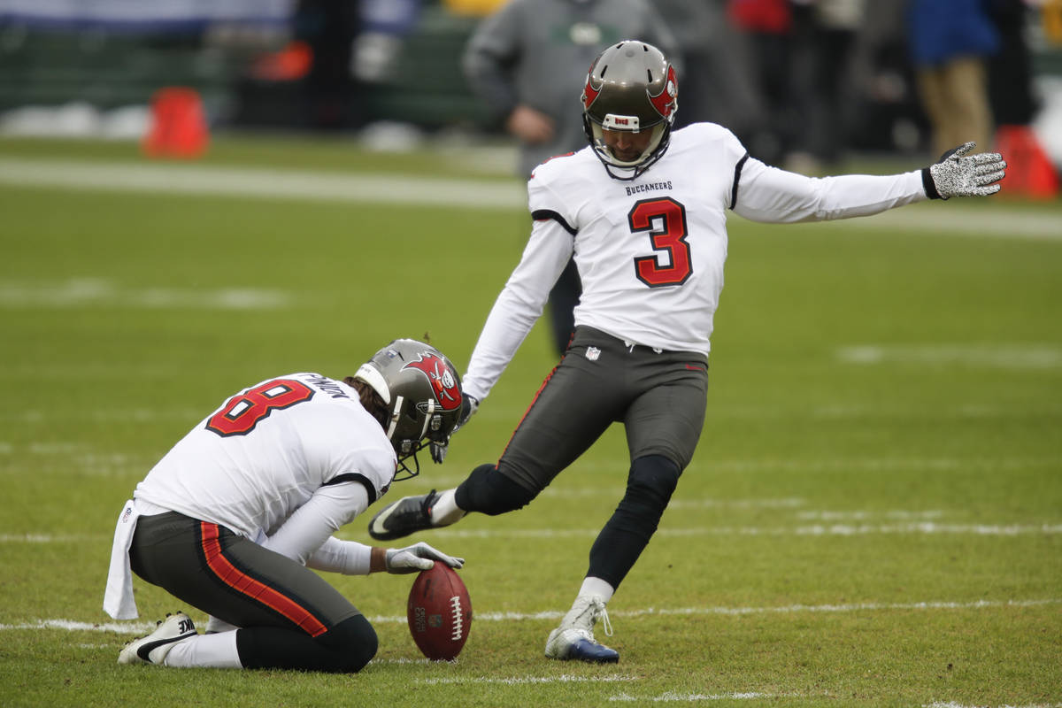 Tampa Bay Buccaneers kicker Ryan Succop warms up with Bradley Pinion (8) before the NFC champio ...