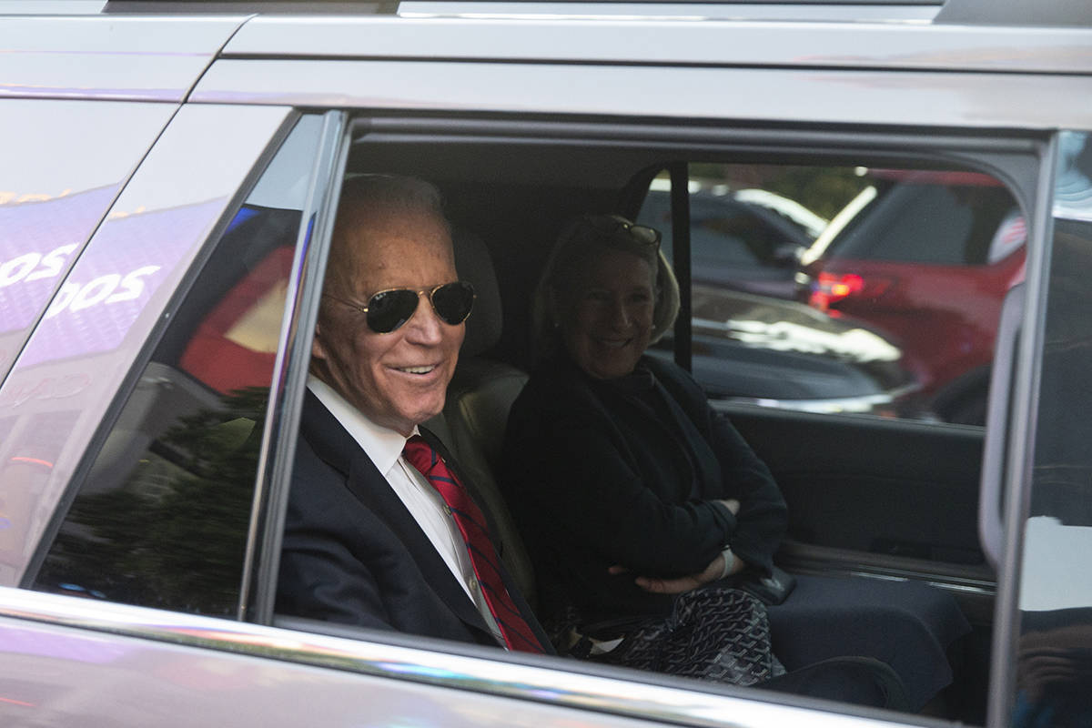 Democratic presidential candidate former Vice President Joe Biden, left, waits to pull into Par ...