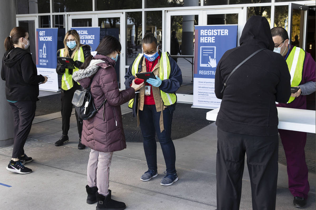 Sym Ciccone, right, a contact tracer from the Southern Nevada Health District and volunteers fr ...